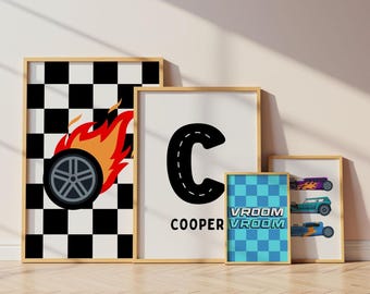 May include: Four framed wall art prints featuring racing themes. One print shows a black and white checkered pattern with a flaming tire. Another displays a large letter C styled like a road with the name COOPER. A blue checkered print says VROOM VROOM, and a final print shows three colorful race cars.