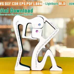 May include: A wooden laser cut art piece of a person with the text "I walk while burnin' burnin', Love has painted me in blood" and "I'm neither clever nor mad come and see what love has" on it.