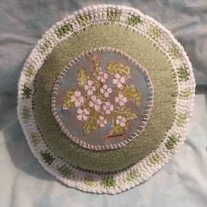 A beautifully crafted pillow of Bluets,a kind of curiously appealing looking flower with a nice border.