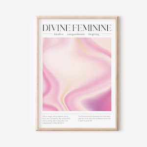 May include: A framed art print with the words "DIVINE FEMININE" in black font. The artwork features a pink and white abstract design. The print also includes text describing the divine feminine.