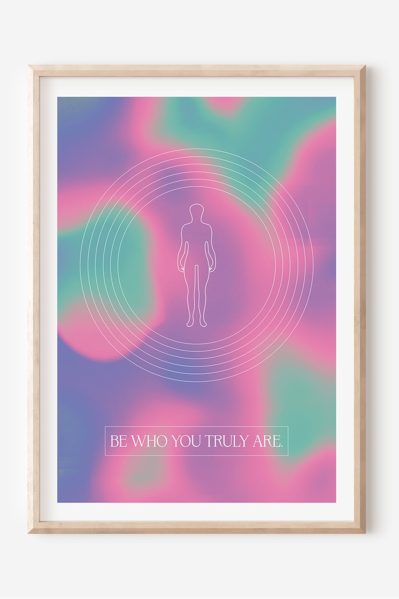 May include: A framed print with a pink, purple, and green gradient background. A white outline of a person is in the center of the print, surrounded by concentric circles. The text "BE WHO YOU TRULY ARE." is at the bottom of the print.