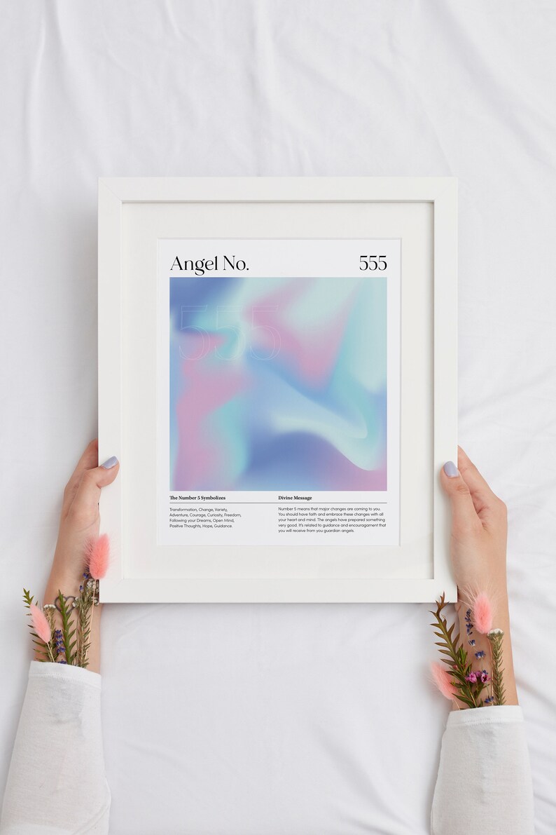 May include: A white framed print with a pink, blue, and purple gradient background. The print features the text "Angel No. 555" at the top and includes a description of the number 5's symbolism and a divine message.