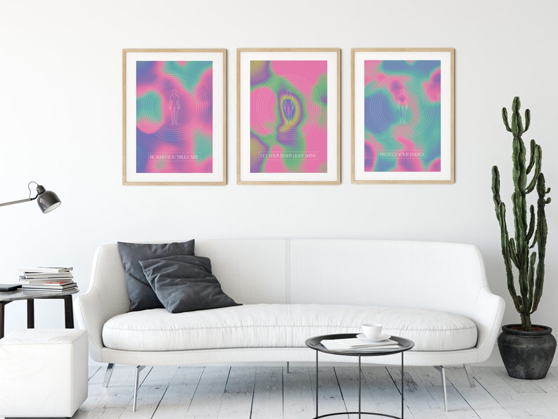 May include: Three framed posters with colorful abstract backgrounds and white text. The text on the posters reads "Be what you trust most", "Let's be our own light shine", and "Protect your energy".