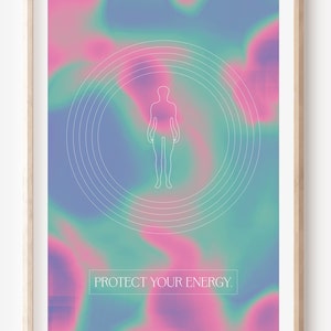 May include: A framed print with a holographic background in shades of pink, blue, and green. A white outline of a person is centered in the image, surrounded by concentric circles. The text "PROTECT YOUR ENERGY." is printed in white at the bottom of the image.