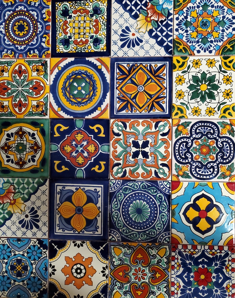 May include: A collection of colourful ceramic tiles with intricate geometric patterns. The tiles feature a variety of colours, including blue, green, yellow, orange, and red. The tiles are arranged in a grid pattern, creating a visually appealing design.