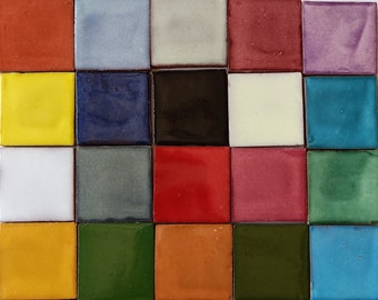 May include: A collection of 20 small square tiles in various colors, including red, yellow, blue, green, white, black, and purple. The tiles are arranged in a grid pattern.