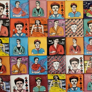 May include: A collection of square ceramic tiles, each featuring a unique portrait of a woman with dark hair and a floral headpiece. The tiles showcase various color palettes and artistic styles, with some incorporating playing card symbols and skull motifs.