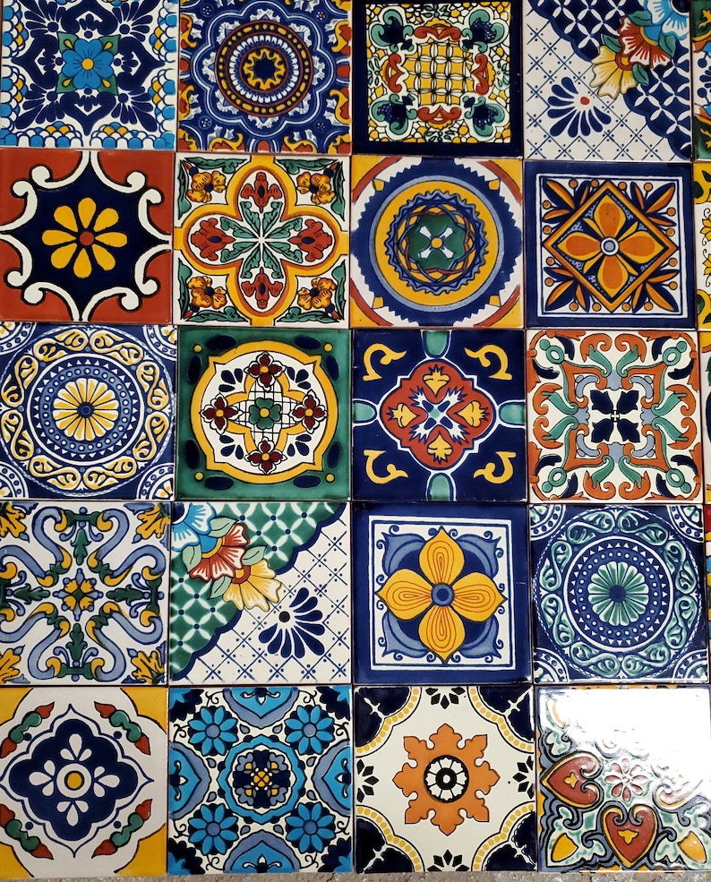May include: A collection of colourful, square, ceramic tiles with intricate geometric patterns in shades of blue, yellow, green, red, and white.
