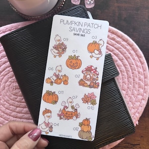 May include: A rectangular white sticker sheet titled PUMPKIN PATCH SAVINGS SAVE $65 featuring twelve numbered illustrations of white ducks, orange pumpkins, a mushroom house, and autumn leaves in shades of orange, brown, and pink.