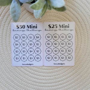 May include: Two white cards with black text and borders. The cards are titled "$50 Mini Savings Challenge" and "$25 Mini Savings Challenge". Each card has a grid of 16 squares with dollar amounts in each square. The amounts are $1, $2, $3, $4, and $5.