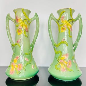 Pair of French Art Nouveau ceramic vases, amphora style with lily relief decor, 38 cm, signed, c.1900