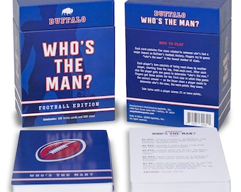 May include: A blue box game titled "Who's The Man? Football Edition" with 100 trivia cards and 500 clues. The box features the Buffalo logo and instructions. A stack of cards with clues and answers is also visible.