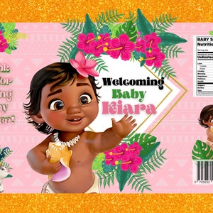 May include: A pink and green baby shower favour bag featuring a cartoon image of a baby Moana holding a seashell. The bag has the text "Welcoming Baby Kiara" and "Thank you for coming to my shower!" printed on it.