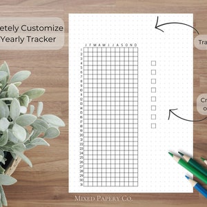 May include: A black and white printable yearly tracker with a grid of squares for each month of the year. The tracker has a dotted background and a space for a title and a scale.