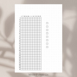 May include: A black and white printable habit tracker with a grid of 31 squares and a column of checkboxes labeled J F M A M J J A S O N D. The tracker is designed for use with a bullet journal or planner.