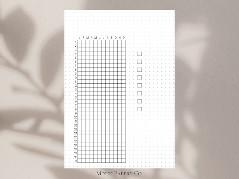 May include: A black and white printable habit tracker with a grid of 31 squares and a column of checkboxes labeled J F M A M J J A S O N D. The tracker is designed for use with a bullet journal or planner.