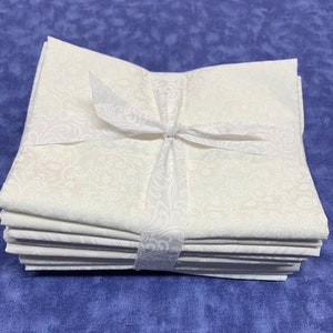10pc fat quarter bundle.  Cowgirl White tone on tone prints.