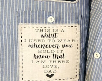 May include: A blue and white striped shirt with a Hasbro patch. A white patch on the pocket reads "THIS IS A shirt I USED TO WEAR whenever you HOLD IT know that I AM THERE LOVE, DAD".