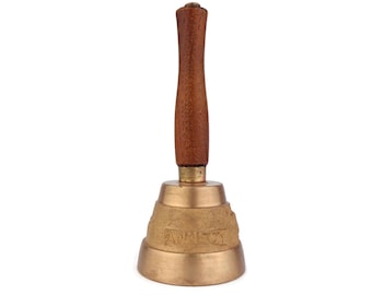 May include: A brass bell with a wooden handle. The bell has a raised inscription that reads "Anniversary".