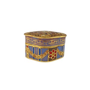May include: A small, square, decorative box with a blue, purple, and gold enamel design. The box has a geometric pattern and floral accents.