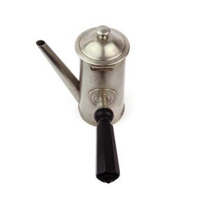 May include: A vintage silver-toned coffee pot with a long spout and a black, faceted handle. The pot has a lid with a small knob and a decorative design near the handle. The coffee pot is likely made of metal.