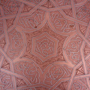 May include: A copper tray with an intricate geometric pattern etched into the surface. The pattern is in a silver color and creates a beautiful contrast against the copper.