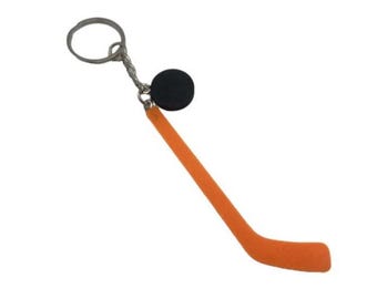 Mini chaveiro de taco de hóquei: acessório raro para fãs de esportes
