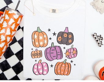 Camiseta estampada de calabaza en tonos pastel: Camiseta cómoda con colores espeluznantes para Halloween.