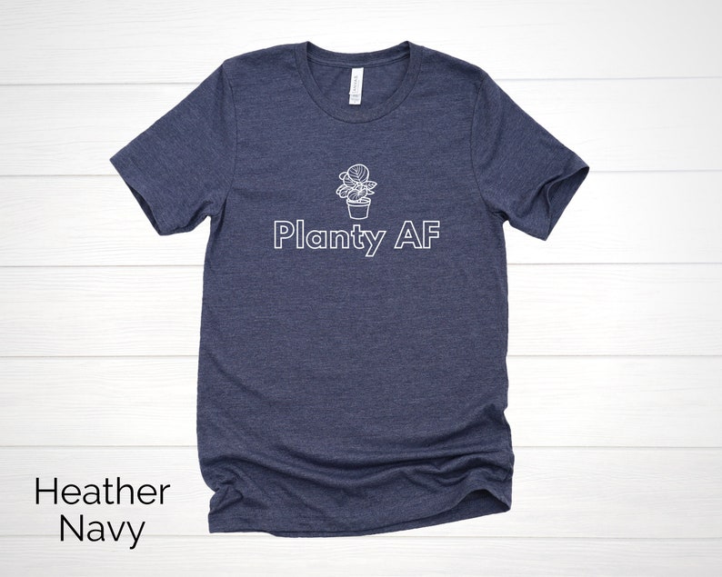 May include: A heather navy blue t-shirt with a white graphic of a potted plant and the text "Planty AF".