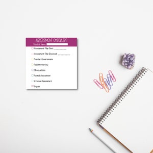 May include: A white assessment checklist with a purple header that reads "ASSESSMENT CHECKLIST". The checklist includes fields for student name, assessment plan, teacher questionnaire, parent interview, observations, and formal and informal assessments. A notebook, pencil, paperclips, and a purple crystal are also present.