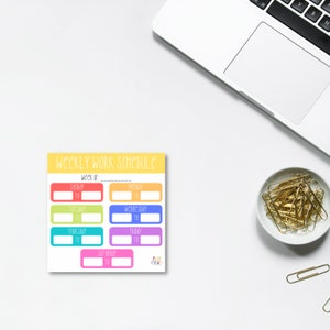 May include: A yellow, orange, red, green, blue, and pink weekly work schedule planner with the text "WEEKLY WORK SCHEDULE" and "week of:" at the top. The planner has spaces to write in the days of the week and the times for each day.