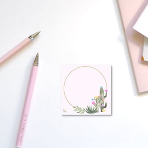 May include: A pink square note card with a gold circle around a watercolor illustration of a cactus with flowers. The text "My Friday" is in the bottom left corner.