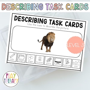 May include: A white task card with the text "DESCRIBING TASK CARDS" and "Use the cues to describe the picture:". The card features a lion image and prompts for color, category, shape, location, parts, function, materials, and size. A pink circle reads "LEVEL 3".