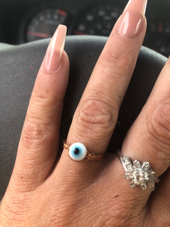 small petite white evil eye copper wire wrapped ring