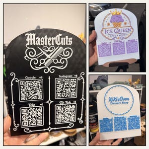 May include: Three arched display signs featuring business logos and QR codes. One black sign displays MasterCuts with Google, Instagram, Yelp, and TikTok codes. One white sign shows Ice Queen Creamery with Zelle, Cash App, and Venmo codes. One white sign shows KiKi's Oven with Zelle, Instagram, and Venmo codes.