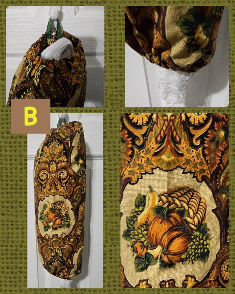 May include: A brown and gold fabric bag holder with a fall harvest print featuring pumpkins, gourds, and grapes. The bag holder is hanging on a white door.