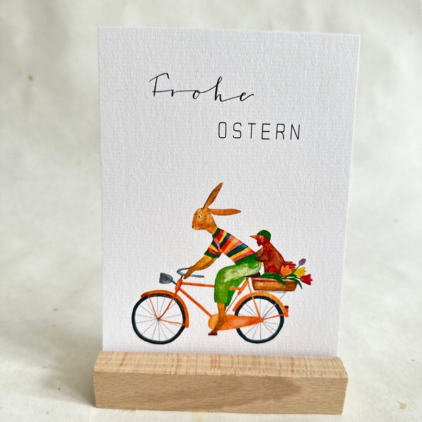 Osterkarte Aquarell /Osterhase und Huhn fahren Fahrrad