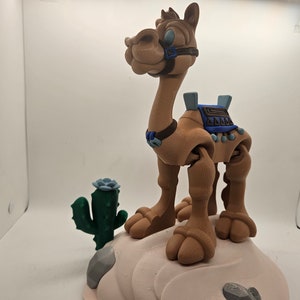 Desert themed display stand for Flexi Camel