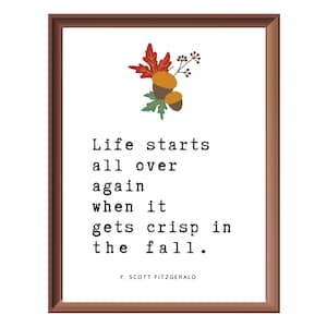 Puede incluir: Una impresión enmarcada con una cita de F. Scott Fitzgerald: "La vida comienza de nuevo cuando llega el otoño."