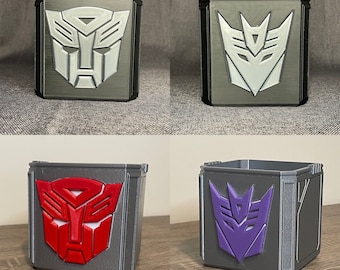 Op transformatoren geïnspireerde Autobot/Decepticon-insignes voor potlood/pen/penseel