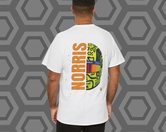 May include: White t-shirt with a yellow and black racing helmet graphic and the word "NORRIS" printed on the back.
