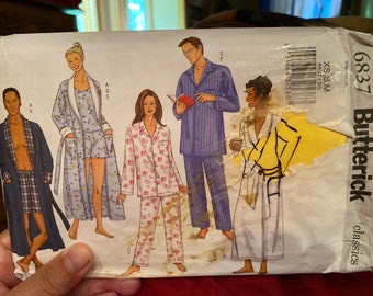 Butterick 6837 unisex adult pajamas and bath robe sewing pattern. Vintage new, uncut . Slight damage to envelope cover only. Sizes XS-M