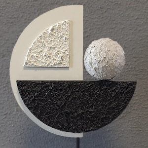 Geometric resin art piece with textured finish