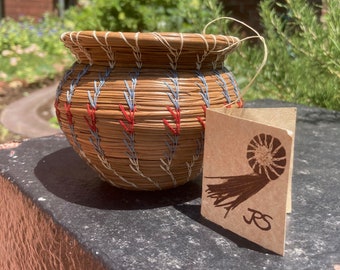 Hand coiled pine needle basket (red, white, and blue thread)