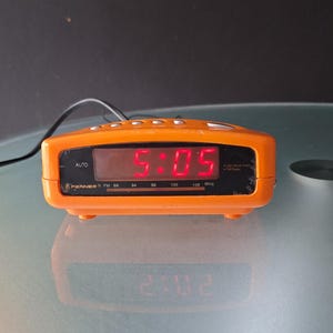 Small Fenner space age radio clock