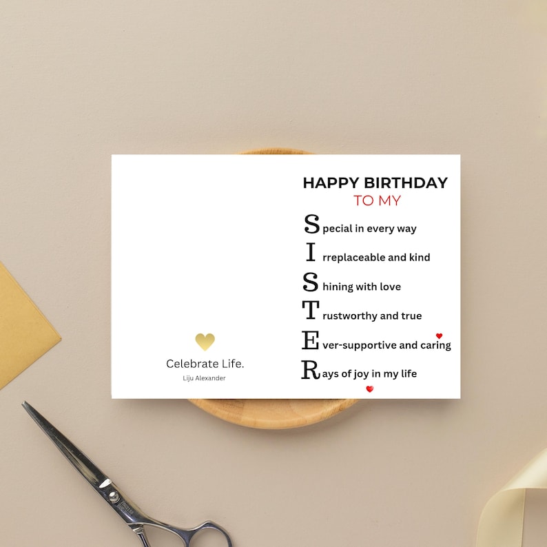 May include: A white greeting card with the text "HAPPY BIRTHDAY TO MY SISTER" in black and red. The card includes an acrostic poem describing a sister. A gold heart and the words "Celebrate Life. Liju Alexander" are also present.