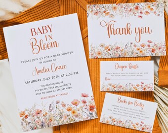 May include: A baby shower invitation suite featuring floral designs and the words "Baby in Bloom." The invitation includes details for Amelia Grace's shower, with a matching "Thank You" card, a diaper raffle card, and a "Books for Baby" card.