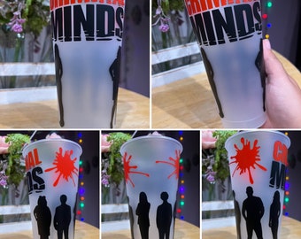 May include: A set of five clear plastic tumblers with a black and red design. The tumblers feature the words "Criminal Minds" and a silhouette of four figures. Some tumblers have red splatter paint.