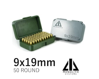 May include: An open green ammunition case filled with brass-colored bullets, next to a closed silver case. The text "9x19mm" and "50 ROUND" is displayed below the cases, with the Monolith Systems logo.