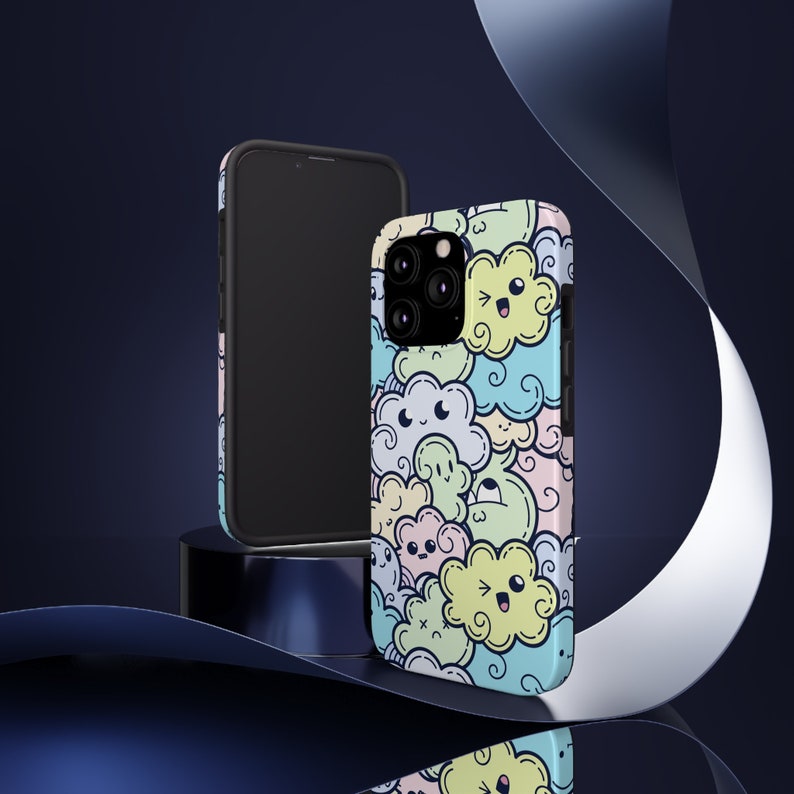 May include: A colorful phone case with a cartoon cloud design. The case is made of durable plastic and features a variety of colors, including blue, green, yellow, and pink. The clouds have cute faces and are surrounded by other doodle-like designs.